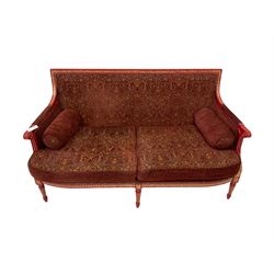 French style sofa, the red and gilt painted show frame with red upholstery, raised on turned and reeded supports  