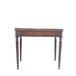 William IV mahogany fold over tea table, with ebonised string inlay, raised on turned reeded supports W90cm