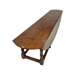 Large 17th century style oak dining wake table, the drop leaf top over gate leg action W397cm, H77cm, D215cm 