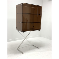 Mid 20th century two door cabinet, the top section from line bent brown frosted lucite with two shelves, raised on a chrome 'X' frame support, W75m, H149cm, D40cm