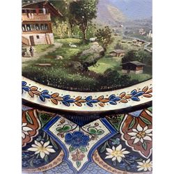 Thoune pottery charger, painted to the centre with a view of Brunnenthal by J. Stauffer, within incised foliate border, signed, D37.5cm 