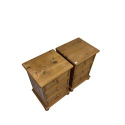 Pair waxed pine bedside chests, fitted with three drawers, raised on turned bun feet 