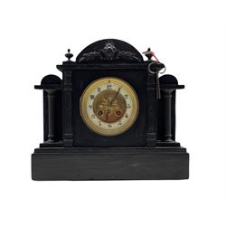 A  late 19th century French mantle clock in a Belgium slate case with an arched top and stepped plinth, with recessed pillars flanking a two-piece dial with an enamel chapter ring and embossed gilt centre, chapter ring with gothic Arabic numerals and minute markers, steel fleur di Lise hands within a cast brass bezel and bevelled glass, eight-day rack striking movement striking the hours and half hours on a coiled gong, with pendulum.


