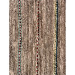 Flatwoven rug, decorated with patterned and raised stitched horizontal bands