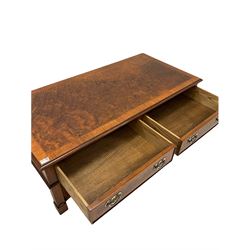 20th century figured walnut coffee table, the cross banded top with herringbone inlay over two drawers and two faux drawers, raised on square supports united by under tier with concave sides and further inlay W122cm, H46cm, D62cm