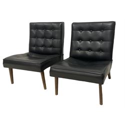 Pair of 20th century Barcelona design chairs, upholstered in buttoned back vinyl, on tapering supports