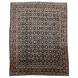 Persian Mahal carpet, indigo ground field decorated with Herati motifs, overall floral design, the guarded border with repeating pattern