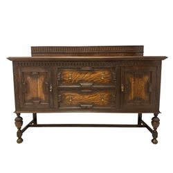 Early 20th century oak sideboard, raised back with arcade carving and bead design, rectangular top over two panelled cupboards flanking two drawers, raised on bulbus supports 