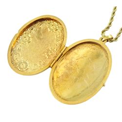Gold hinged locket pendant, on gold rope twist necklace, both 9ct
