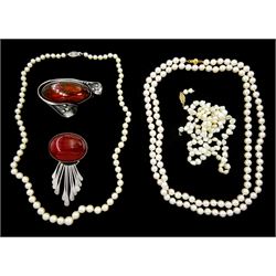 Single strand long cultured white/pink pearl necklace, with 18ct gold clasp, two other pearl necklaces, both with 14ct gold clasp, silver Baltic amber brooch and other silver stone set fringe brooch
