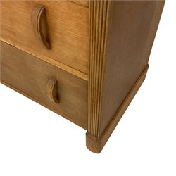 Early 20th century oak chest, fitted with three graduating drawers flanked by reeded uprights