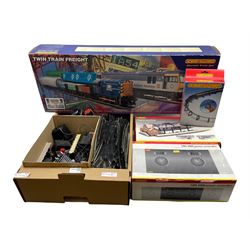 Hornby Railways OO Gauge R1002 Twin Train Freight Set (incomplete), Hornby HM 200 Power Controller unit (untested), various lengths of track, rolling stock, trackside accessories etc in one box