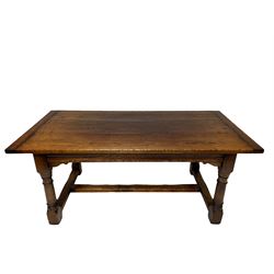 Jacobean style oak refectory dining table, rectangular plank top with breadboarded ends, moulded frieze rails on turned supports joined by H-shaped stretchers