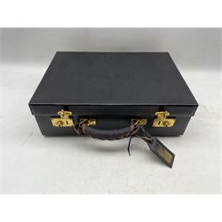 An early 20th century French leather travelling fitted vanity case, retailed A. Hardy 78. Rue de Turenne. Paris, with canvas protective cover L48cm 