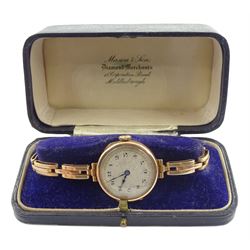 Early 20th century 9ct gold manual wind wristwatch, London import marks 1921, on rose gold spring loaded expanding strap, stamped 9ct, boxed