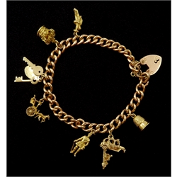 Gold curb link bracelet with heart locket and seven gold charms including horse and carriage, car and crown, all hallmarked 9ct 