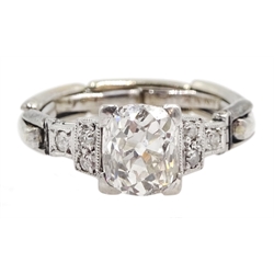 Art Deco platinum diamond ring, the central cushion cut diamond of approx 1.10 carat, with three diamonds either side, on a later 9ct gold expanding shank