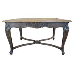 20th century French oak dining table, the parquetry top over carved and shaped frieze, raised on scrolled cabriole supports, united by stretchers 