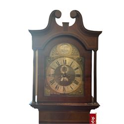 8-day mahogany cased longcase clock with a brass dial striking the hours on a coiled gong (missing), brass break arch dial with silvered chapter ring, Roman numerals, Arabic five-minutes and minute track, with semi-circular calendar aperture and seconds ring, cast spandrels with a silvered boss to the break arch inscribed “Tempus Fugit”, inlaid mahogany case with a swan’s neck pediment and reeded pillars to the hood and case, conforming plinth on shallow bracket feet. No pendulum or weights. Hands missing.