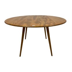 Ercol - mid-20th century elm and beech 'Round Shaped Dining Table', drop leaf top with sliding metal rods, over splayed tapering supports