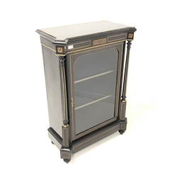 Victorian ebonised pier  cabinet, the rectangular top with square lobe protruding front corners, frieze with boxwood strung and parquetry inlay, the arched glazed door enclosing interior with two fixed shelves and lined in deep blue silk, flanked by turned fluted and and parcel gilt tapering pilasters, having gilt metal mounts to frieze, door and pilasters, raised on turned supports 