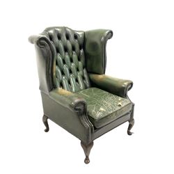 Early to mid 20th century wing back chair, upholstered in studded and deep buttoned green leather, with squab cushion, raised on cabriole supports W81cm