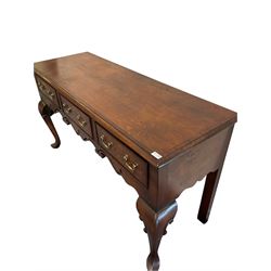 Georgian design oak dresser base, the rectangular crossbanded top and three frieze drawers over shaped and pierced apron, raised on cabriole supports 