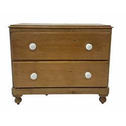 Victorian pine chest fitted with two deep drawers and ceramic pull handles, raised on turned supports W102cm, H87cm, D47cm 