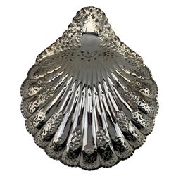 Edwardian silver shell shape fruit dish with fluted and floral decoration, pierced border, the floral embossed handle inscribed 'M' 28cm x 24xm Sheffield 1905 Maker Atkin Bros. Retailer's mark of Whytock & Sons, Dundee
