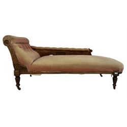 Victorian chaise longue, the walnut frame with buttoned back red fabric raised on turned supports, terminating in ceramic castors 