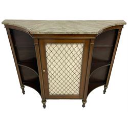 Early 20th century Regency Revival mahogany side cabinet, rectangular form with concaved ends, green marbled finish top over central cupboard enclosed by grille and fabric panelled door, with turned simulated ivory handles, flanked by concaved shelves, mounted by brass beading, on turned tapering feet 