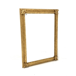 Gilt framed wall mirror of 18th century design, moulded frame with applied acanthus leaf to each corner