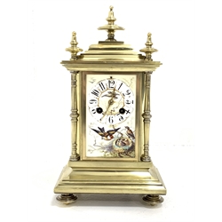20th century brass mantel clock, three finials over caddy top and three panels painted with birds and Arabic chapter ring, stepped base under, eight day movement striking hammer on coil  