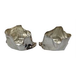 Pair of novelty silver vases by Rebecca Joselyn modelled as crumpled bags, H4.5cm hallmarked Sheffield 2013. Rebecca Joselyn studied at Sheffield Hallam University and graduated in 2006.  She has won numerous awards for her 'From the Shed' and 'Packaging' collections
