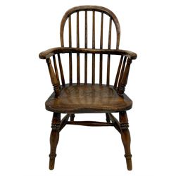 19th century child's elm Windsor chair, double hoop stick back over dished seat, raised on ring turned supports united by swell turned H-stretcher