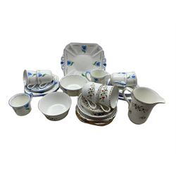 Shelley Blue Tulip pattern tea set comprising five cups & saucers, six tea plates, sugar bowl, milk jug and sandwich plate no. 11941, together with a Shelley Chelsea pattern part tea set comprising two mugs & saucers, two further saucers, milk jug, sugar bowl and seven tea plates 