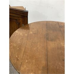 Mid 19th century oak tilt top occasional table, the circular top raised on turned column and three splayed supports (D90cm) together with a small oak corner cupboard with single panelled door (W60cm)