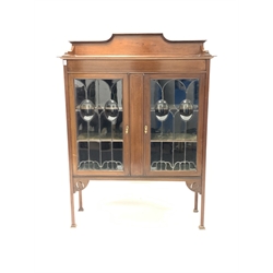 Edwardian Art Nouveau inlaid mahogany display cabinet, with raised back over two glazed doors, raised on square supports 