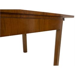 Art Deco walnut extending dining table, rectangular top with canted corners, raised on chamfered supports (W153cm D92cm H77cm); and set six matching walnut chairs, geometric shaped back rail, drop in seat upholstered in floral tapestry fabric (W46cm D52cm H90cm)