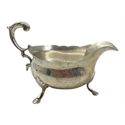 18th century silver sauce boat with crimped rim, acanthus leaf 'C' scroll handle and hoof feet L17cm, marks rubbed but circa 1760  8.1oz
