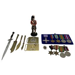 Group of four WWII medals including War Medal, Defence Medal, Africa Star and 1939-1945 Star, group of five medals with reproduction DFC and Air Crew Star, three Trench Art knives, stiletto, metal figure of a Scottish soldier etc