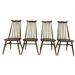 Ercol - set four mid-20th century beech and elm 'Goldsmith's Windsor Dining Chairs', yoke top over high spindle back, raised on tapering supports with H-stretcher