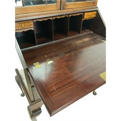 Early 20th century mahogany bureau bookcase, the bookcase top with glazed doors over bureau base, raised on cabriole supports