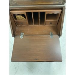 20th century mahogany bureau bookcase, broken arch pediment with urn finial over glazed door enclosing two shelves, fall front under revealing fitted interior, three drawers, raised on bracket supports, with pained floral motif W58cm