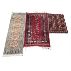 Afghan Bokhara rug with red field, together with a Bokhara runner and mat 
