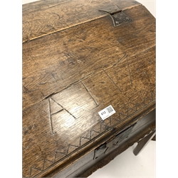 18th century oak bible box, sloped front lifting to reveal interior fitted with two cubby holes, and inscribed 'A T 1751' raised on an associated oak stand with chamfered supports, W68cm, H95cm, D60cm