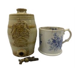 19th century stoneware barrel inscribed Whisky and with Royal coat of arms and brass tap and a large 19th century blue and white mug H15cm