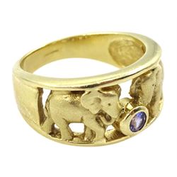 Gold elephant design ring, set with a single round tanzanite