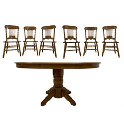 Oak extending dining table, circular top with moulded edge and rope-twist frieze, over turned and fluted pedestal with quadriform base and reeded supports (W108cm H75cm); and set six oak chairs, cresting rail carved with foliate designs, spindle back flanked by turned uprights, the turned supports united by stretchers (W50cm D47cm H104cm)
