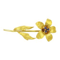 18ct gold flower brooch set with three round cut sapphires, London import mark 1989